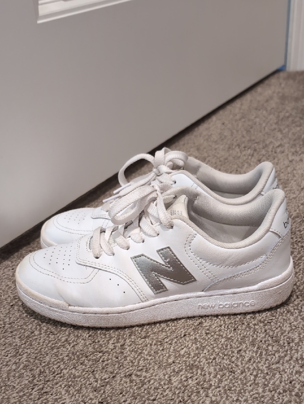 New Balance White Sneakers with Silver Logo Accent